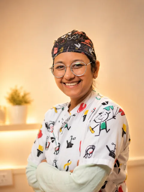 Dr. Shivika Agarwal at the clinic in her pediatric scrubs