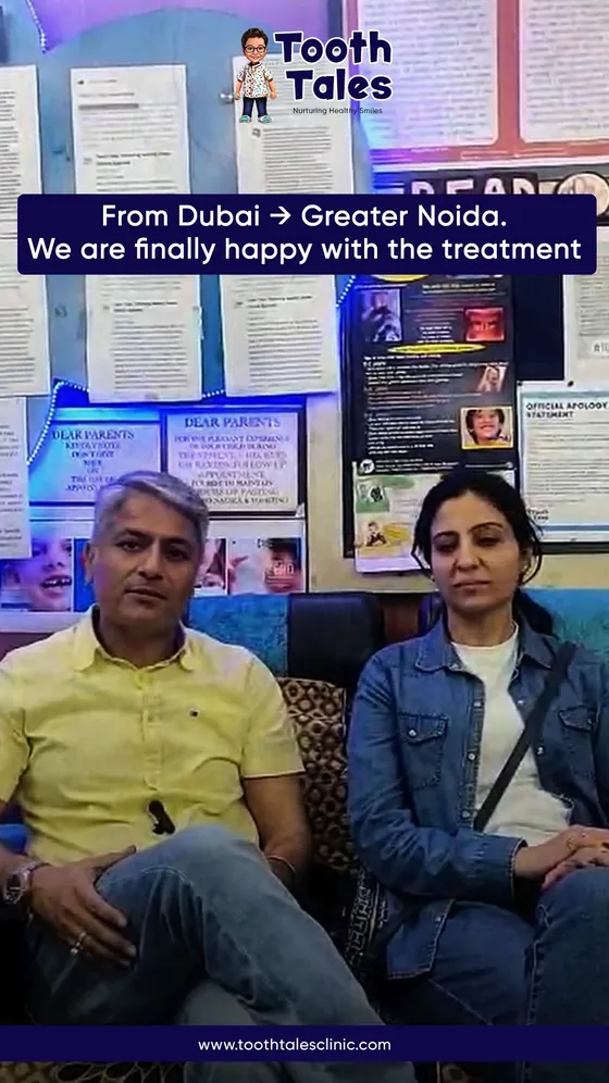Two parents seated in the Tooth Tales waiting area