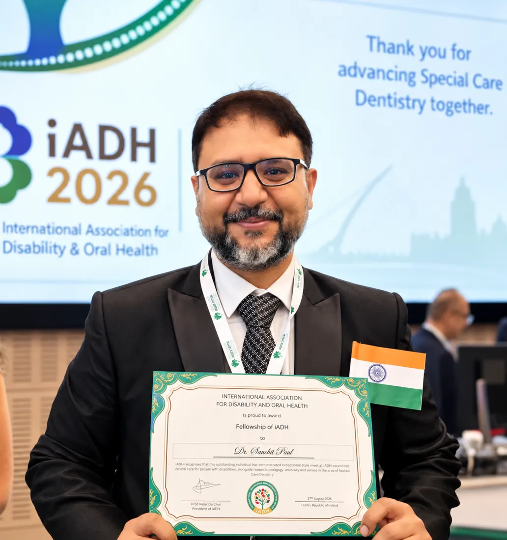 Dr. Sanchit Paul holding the Fellowship certificate of the International Association for Disability and Oral Health