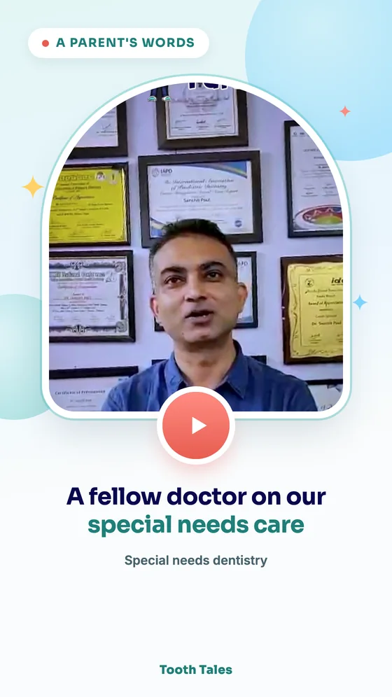 A doctor speaking to camera in front of the clinic's certificate wall