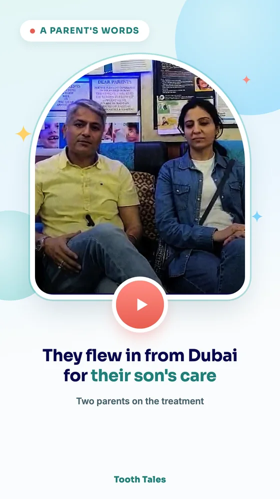 Two parents seated in the Tooth Tales waiting area